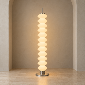 Phel sculptural opal floor lamp on a pale architectural studio background