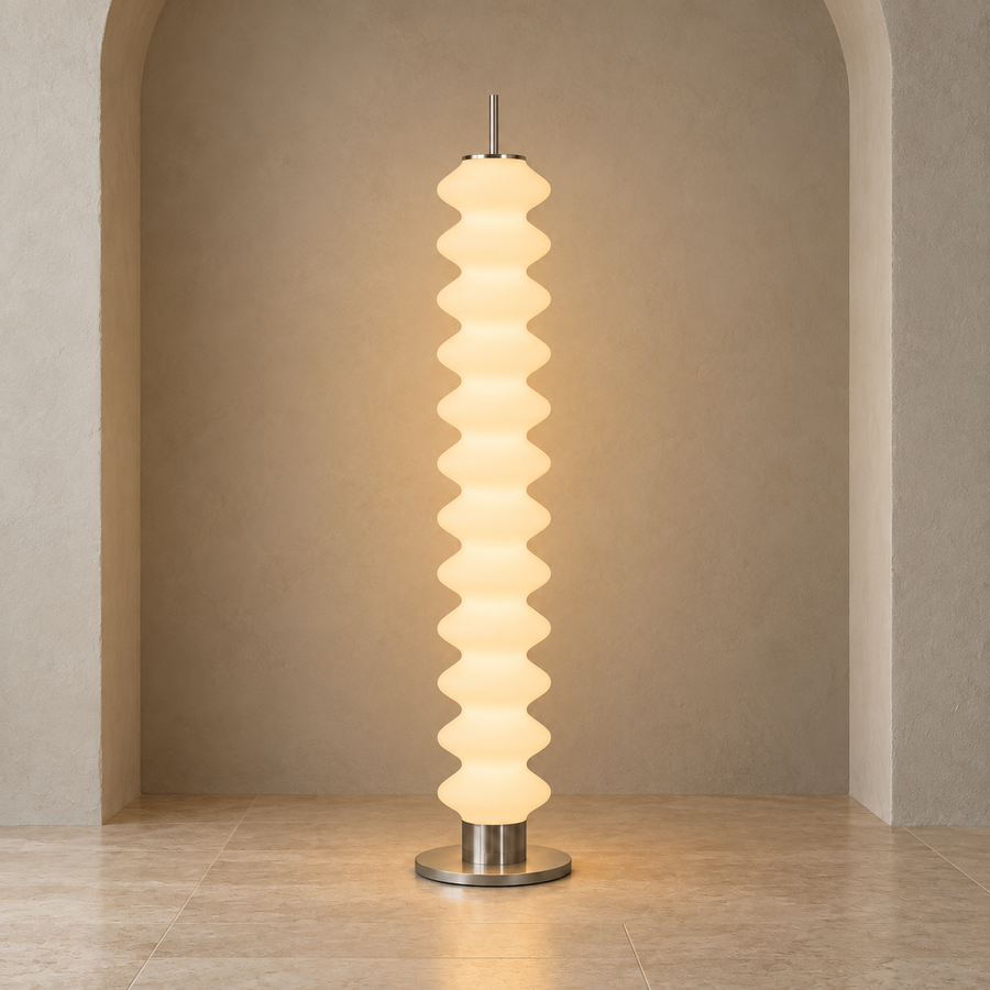Phel sculptural opal floor lamp on a pale architectural studio background
